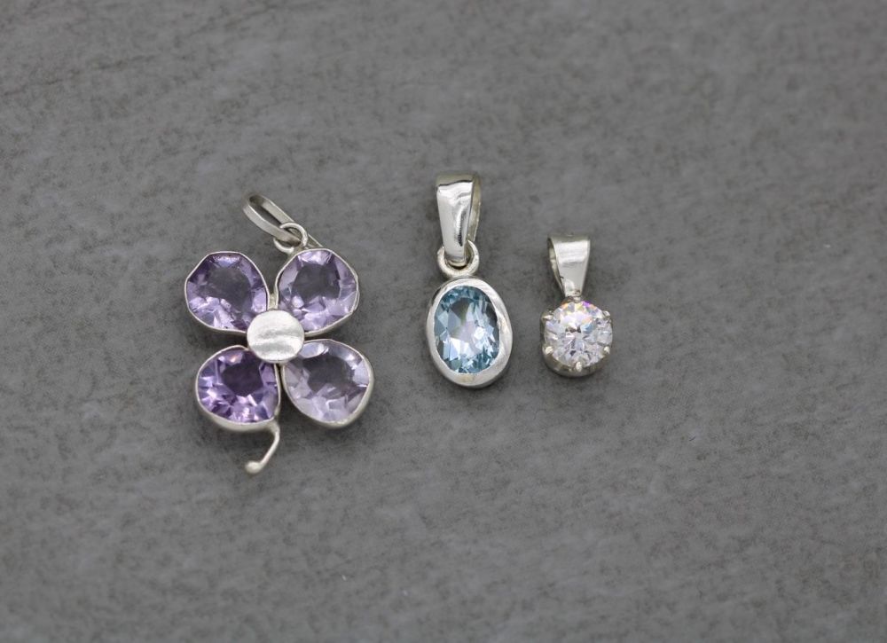 REFURBISHED 3 x sterling silver pendants; amethyst flower, blue oval & classic clear solitaire