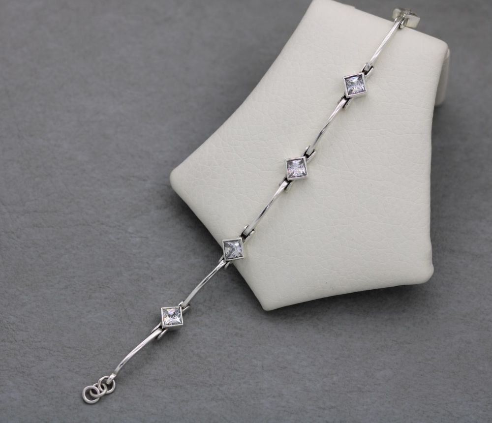 Sterling silver bracelet with faceted clear square stones