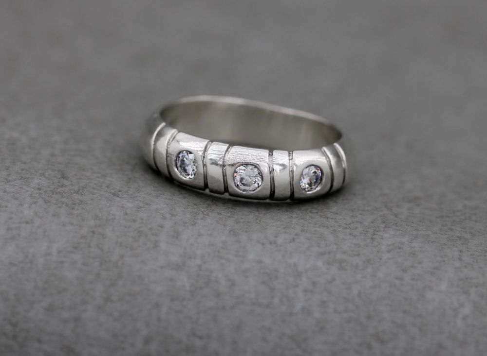 Sterling silver ring with clear stones & line texture