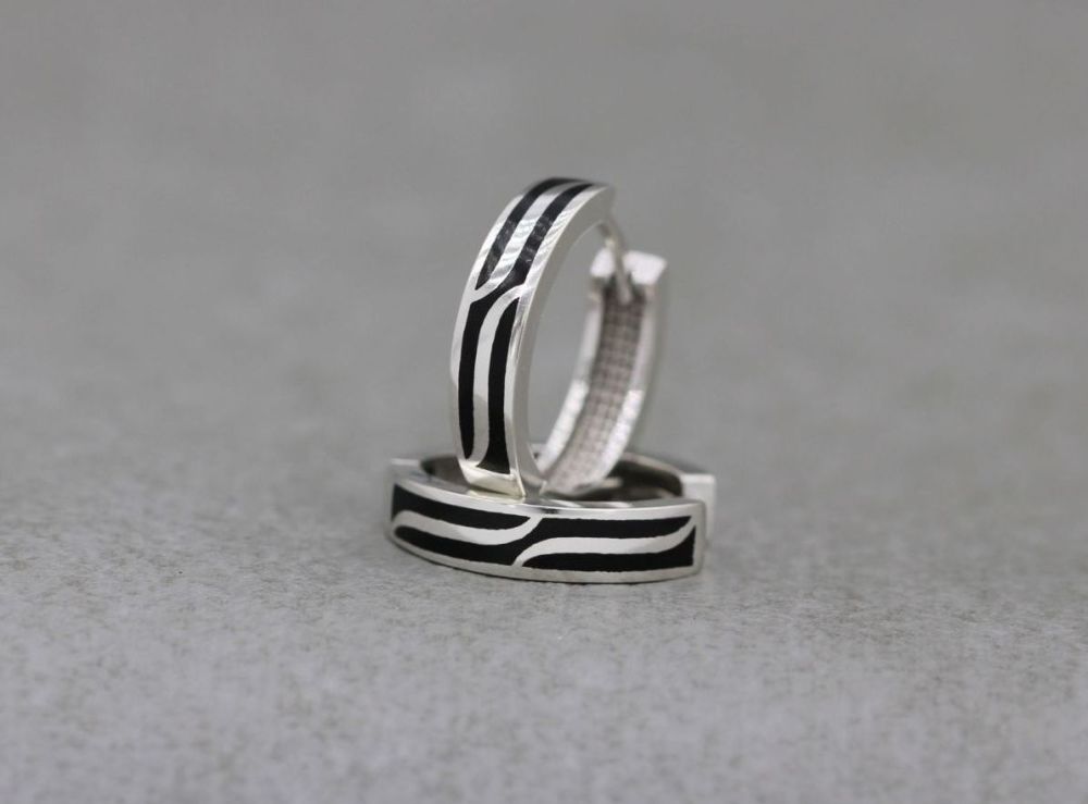 Sterling silver hoop earrings with black striped inlay