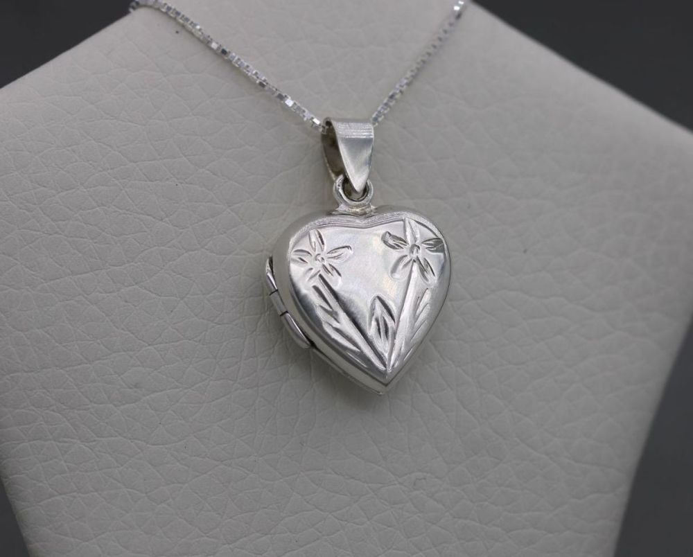 Sterling silver heart shaped locket with a flower design
