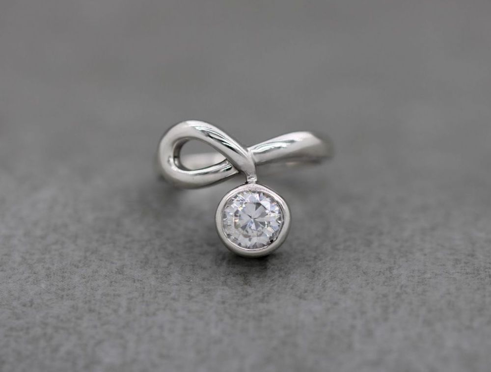 Fancy asymmetric sterling silver & clear stone solitaire ring