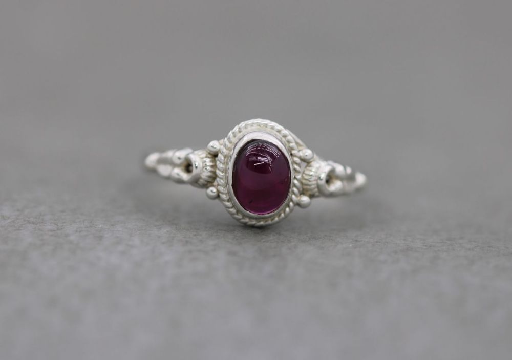 Fancy sterling silver & garnet solitaire ring
