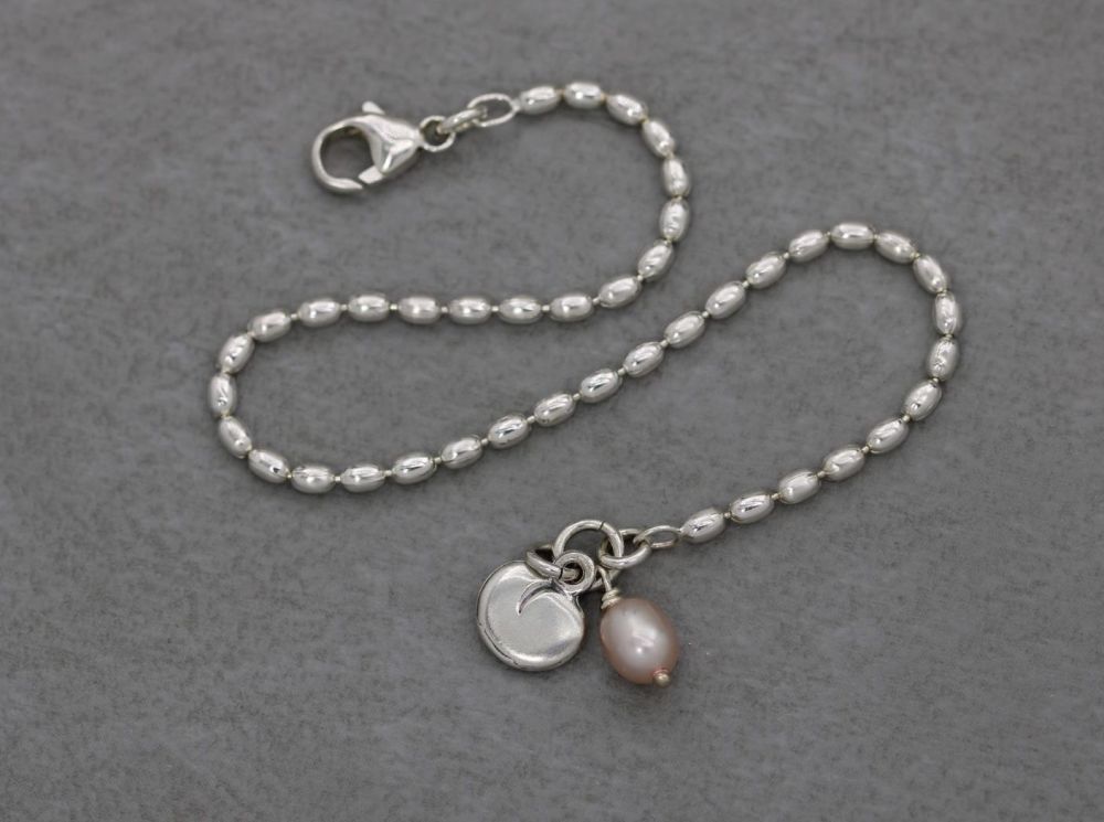 Sterling silver bead chain bracelet with a pink freshwater pearl