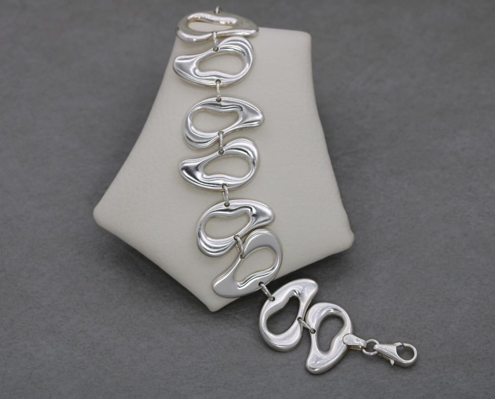 Heavy sterling silver bracelet with irregular shape domed sections