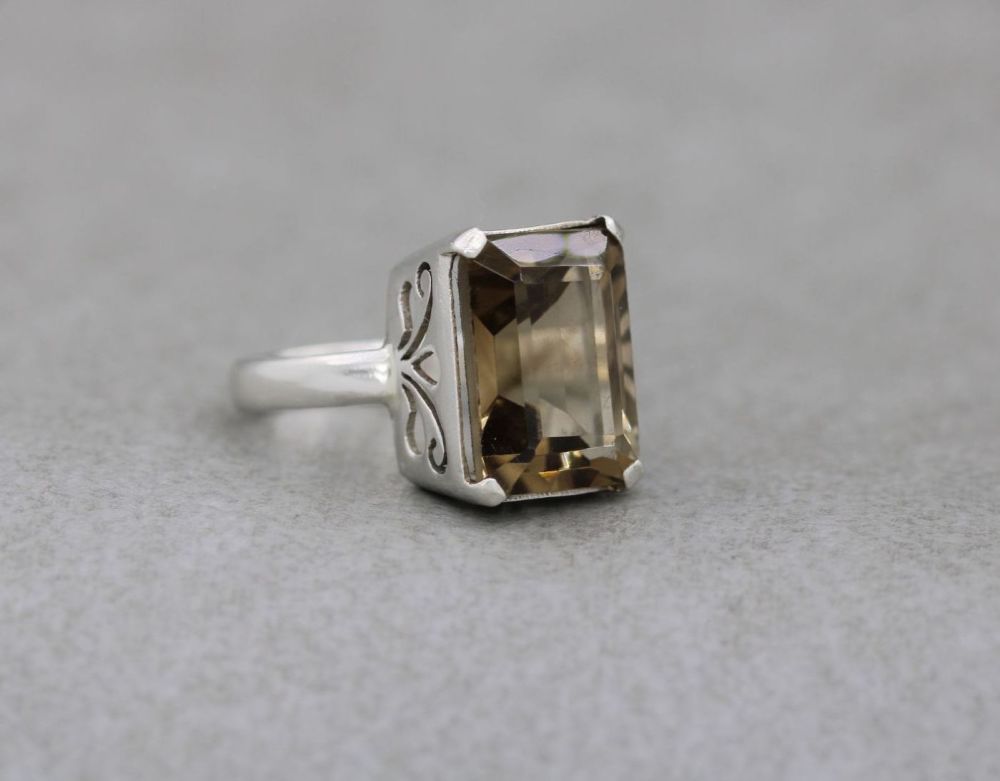 Sterling silver & imitation smokey quartz ring with a fancy proud setting