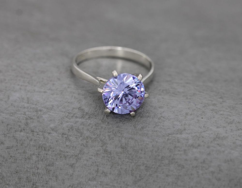 Proud set sterling silver & pale purple solitaire ring