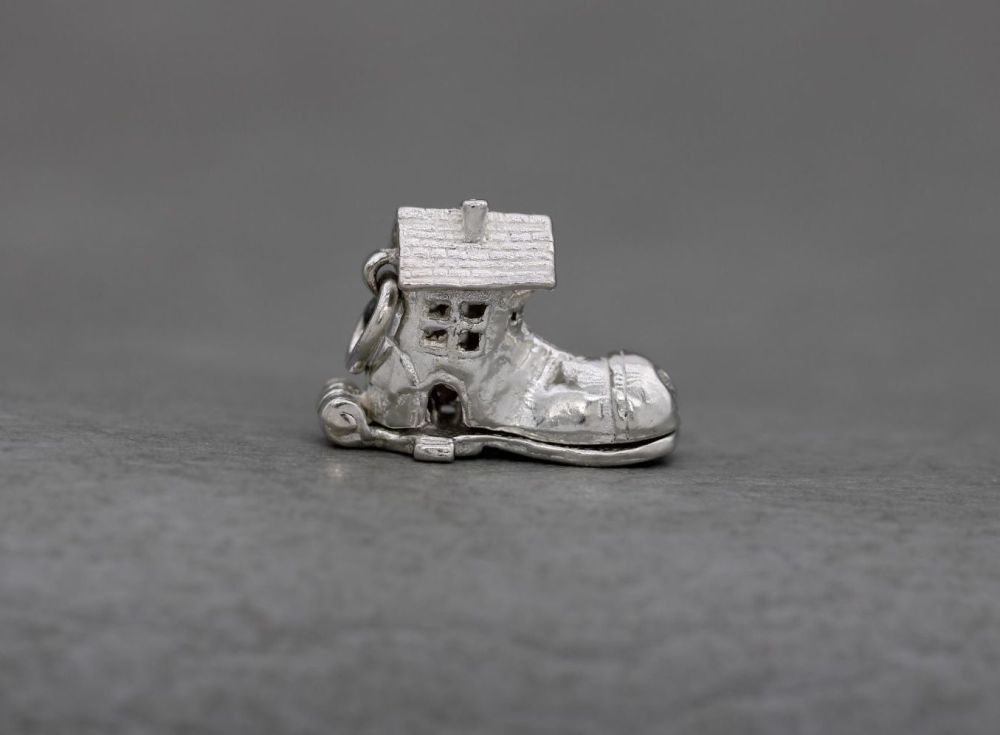 Vintage silver opening charm; little old woman who lived in a shoe