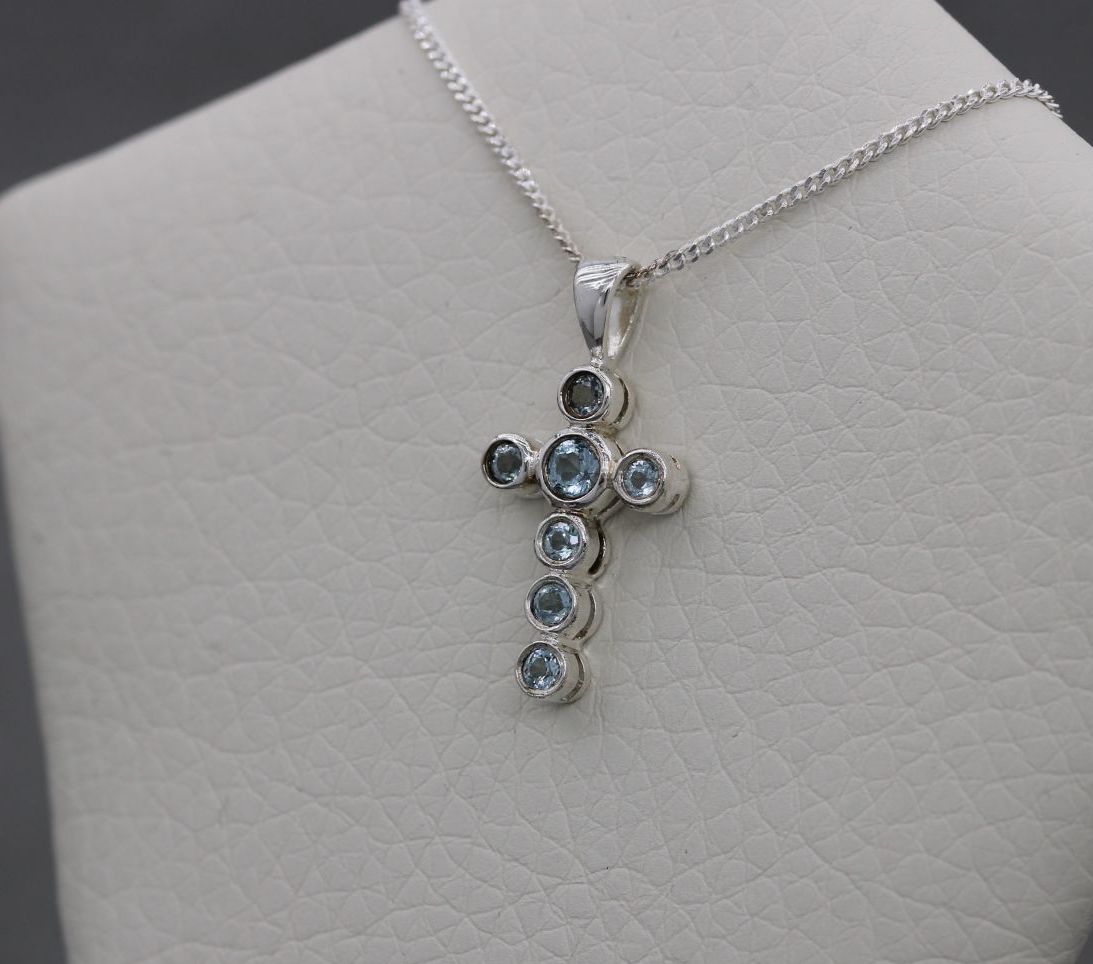 NEW Small sterling silver & pale blue stone cross necklace