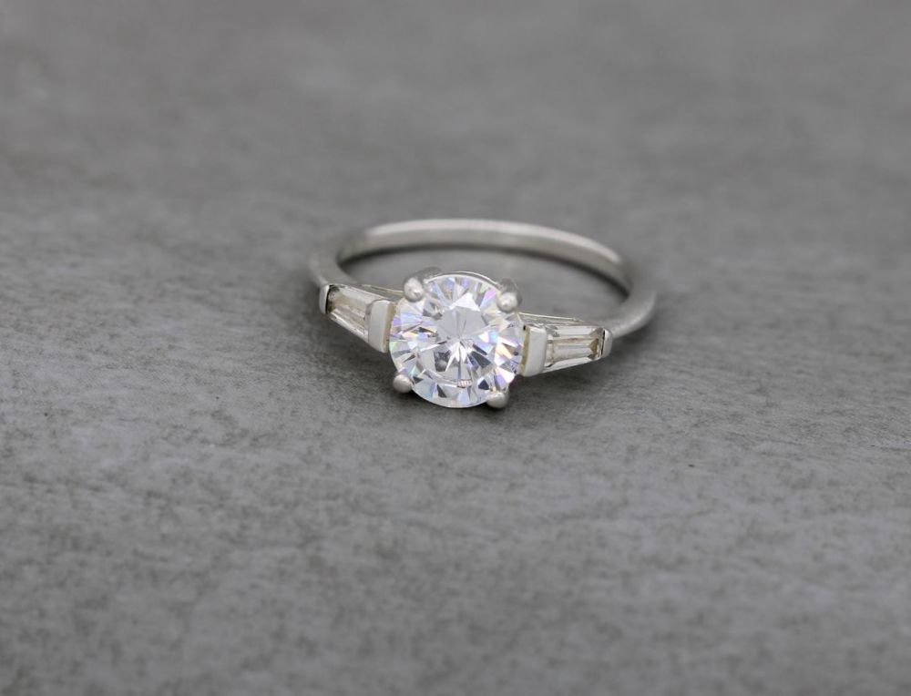 Sterling silver solitaire ring with stone accented shoulders