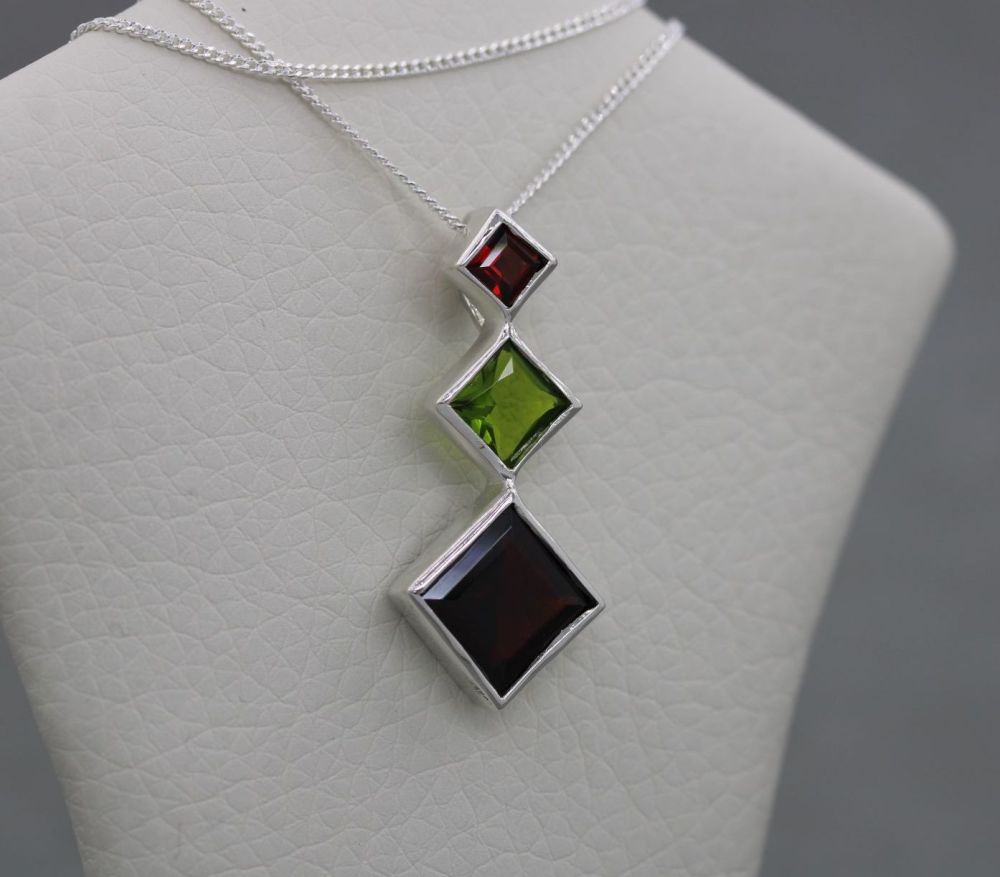Graduated sterling silver necklace with vivid red & green stones