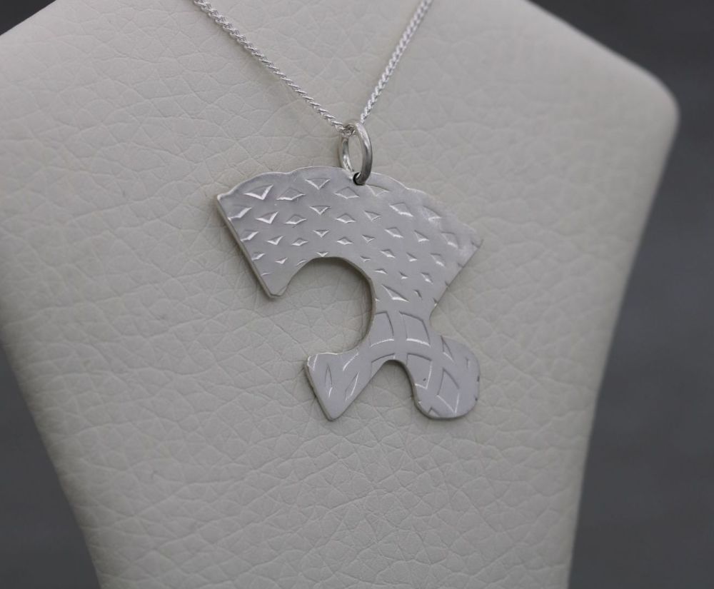 Textured sterling silver jigsaw piece necklace