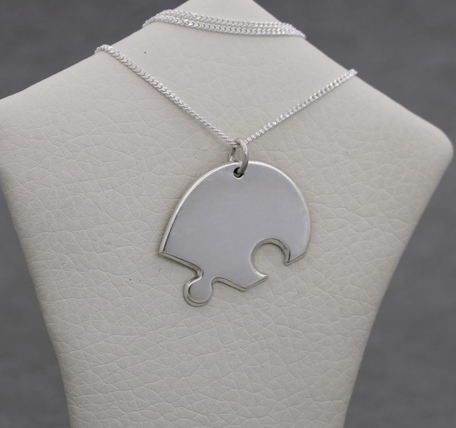Sterling silver jigsaw piece necklace