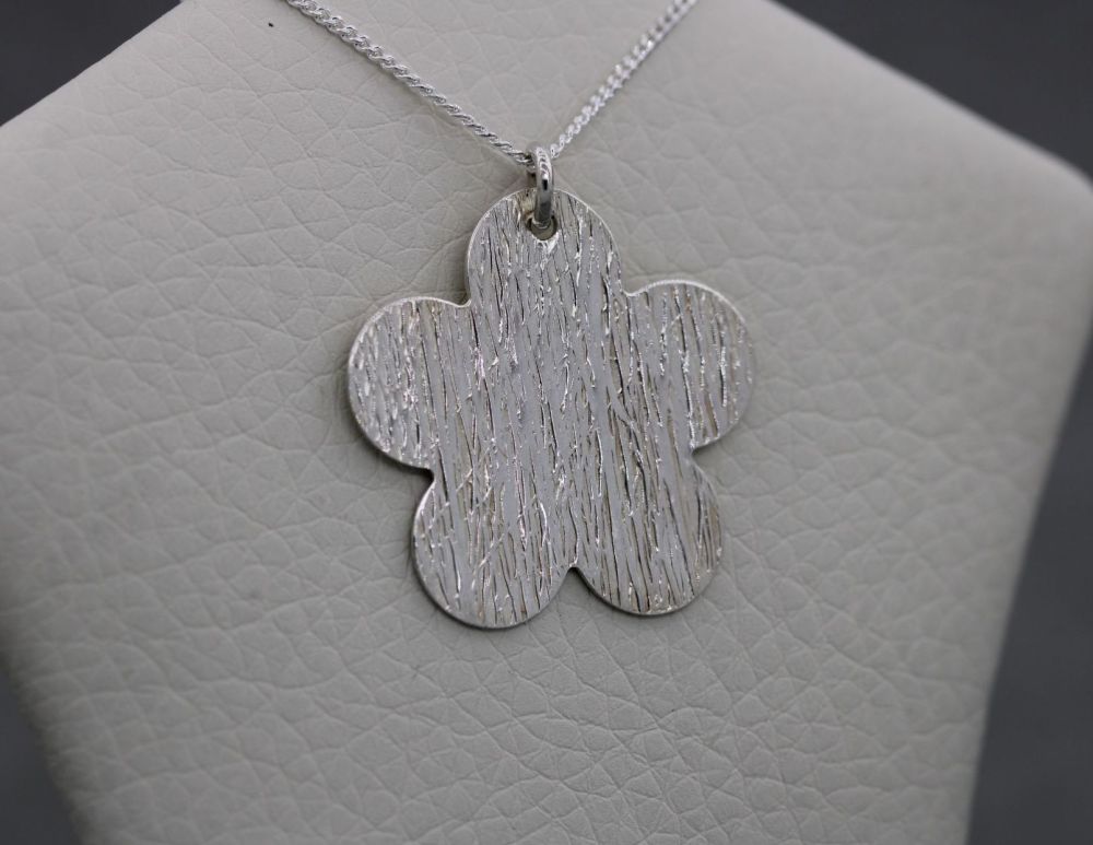 Handmade textured sterling silver flower necklace