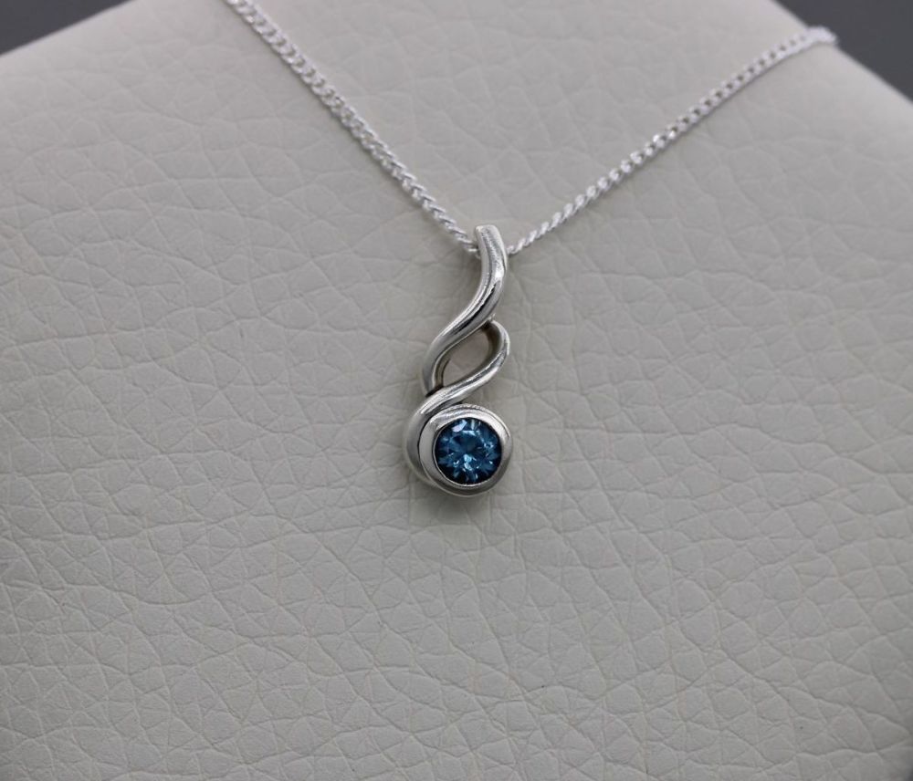 Small sterling silver & blue topaz necklace with a twist