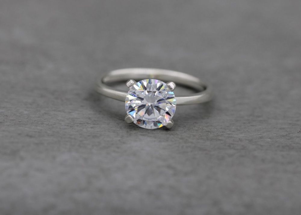 Sterling silver claw set clear stone solitaire ring
