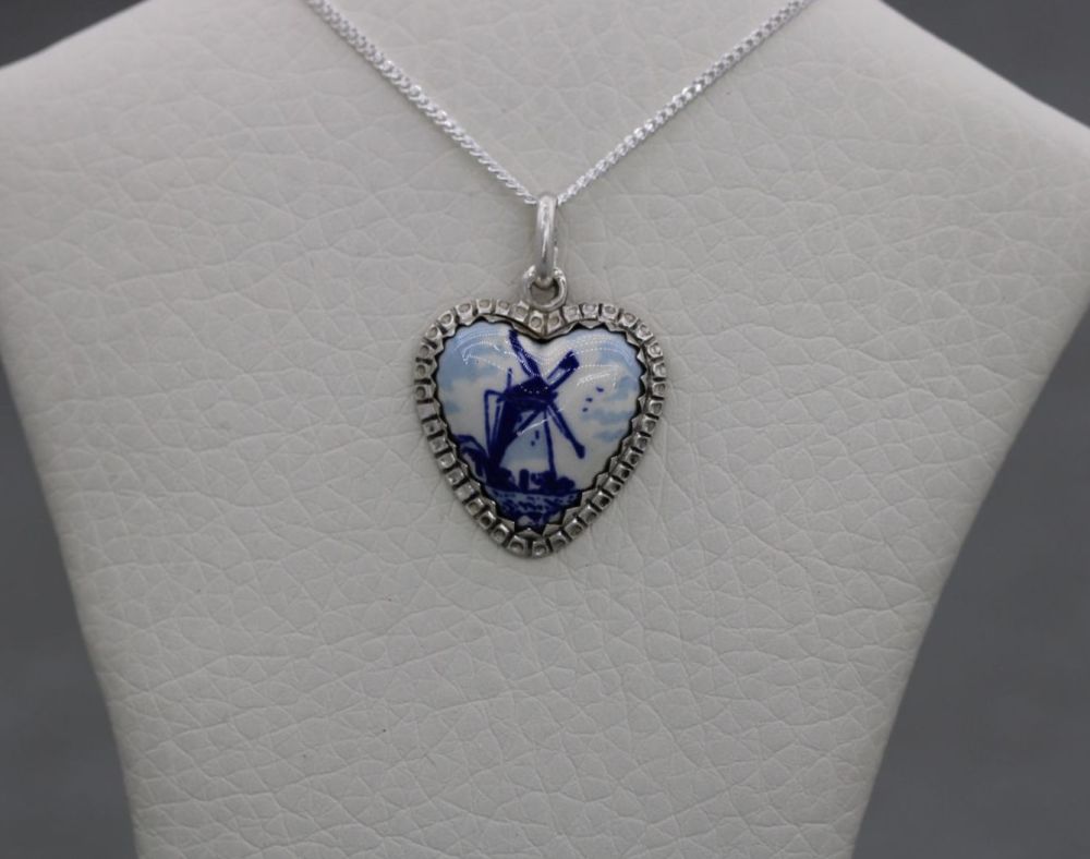 Small silver & ceramic heart necklace with a blue & white windmill design