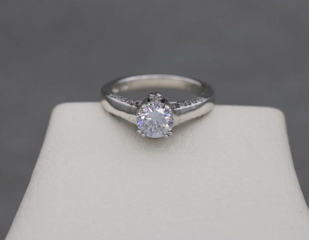 Fancy sterling silver & clear stone solitaire ring with accents