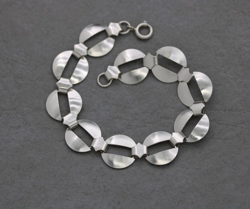 Sterling silver gently domed disc bracelet