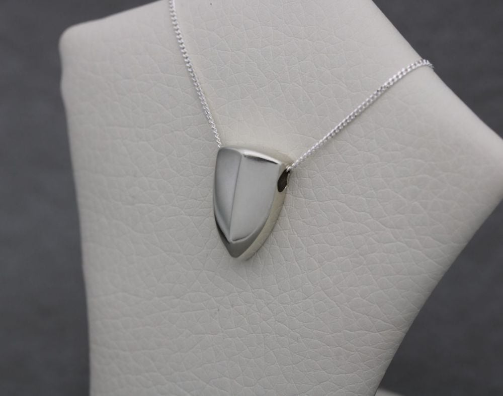 Sterling silver necklace with a shaped, pointed pendant