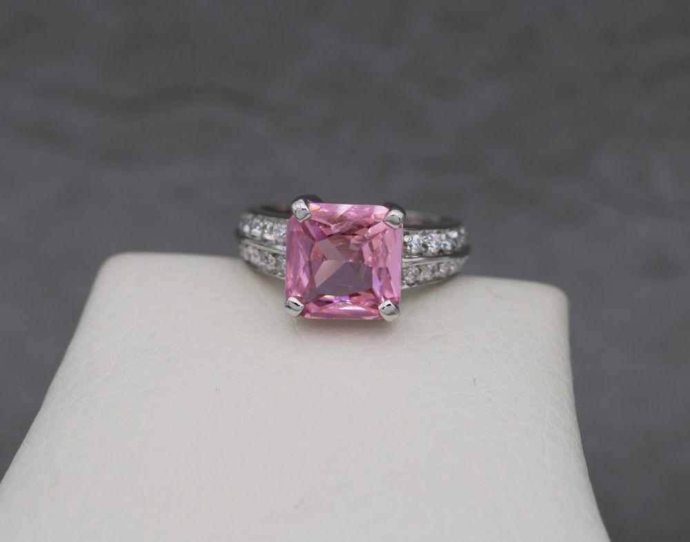 Sterling silver ring with a square pink stone & clear stone accented should