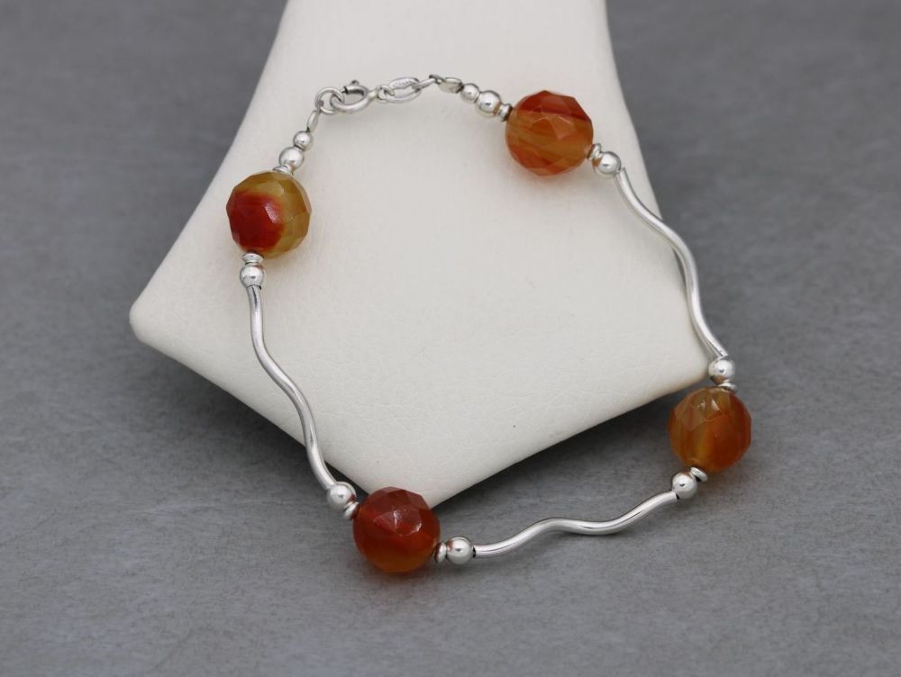 Sterling silver bracelet with faceted carnelian beads