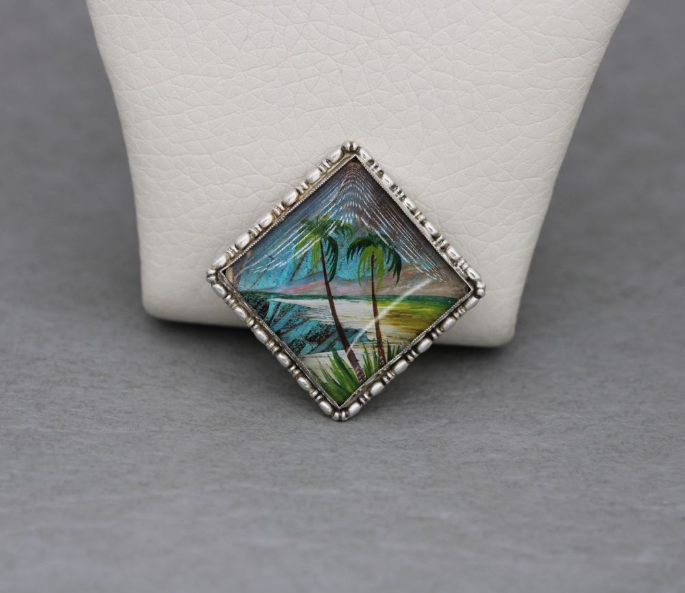 Vintage sterling silver & butterfly wing brooch with a painted beach scene