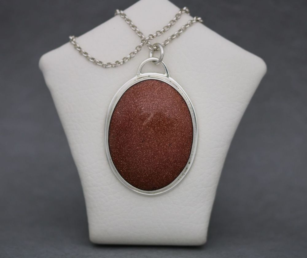 Large sterling silver & goldstone necklace