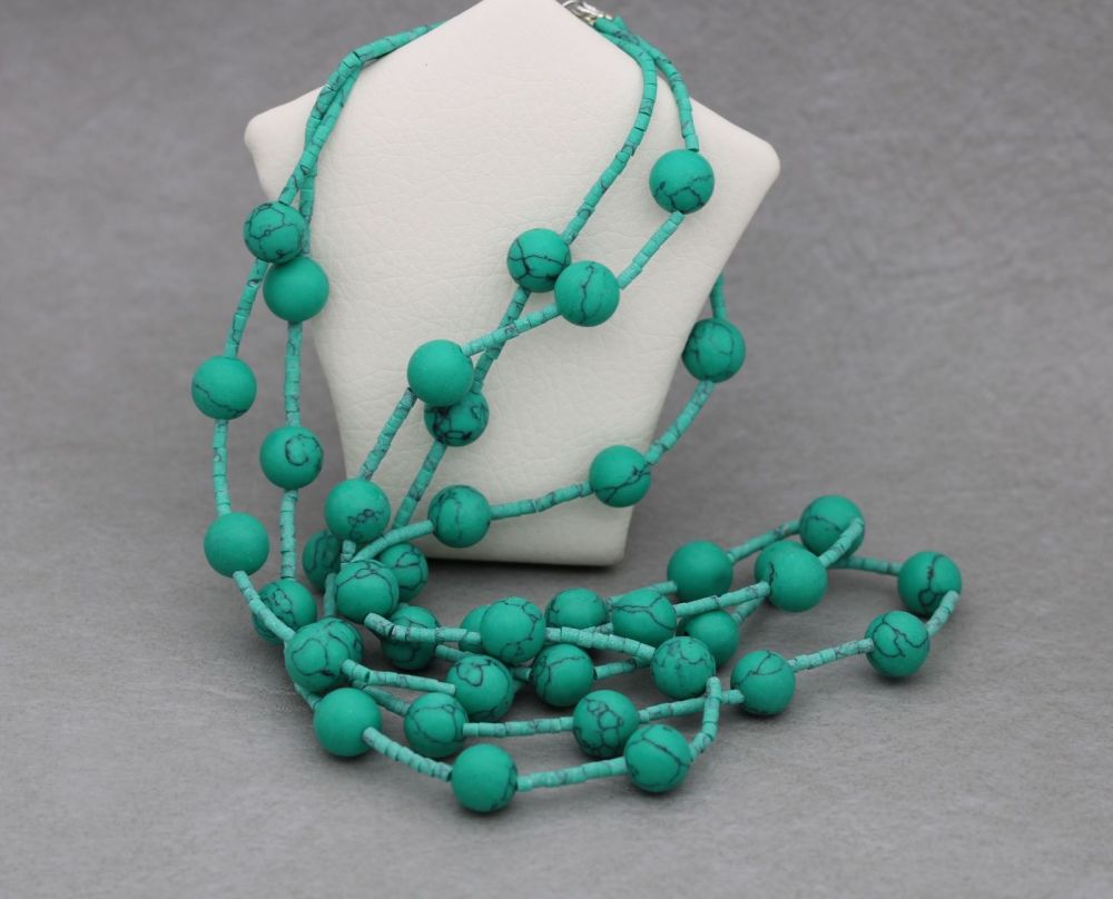 Triple stranded green turquoise & green howlite bead necklace with a sterli