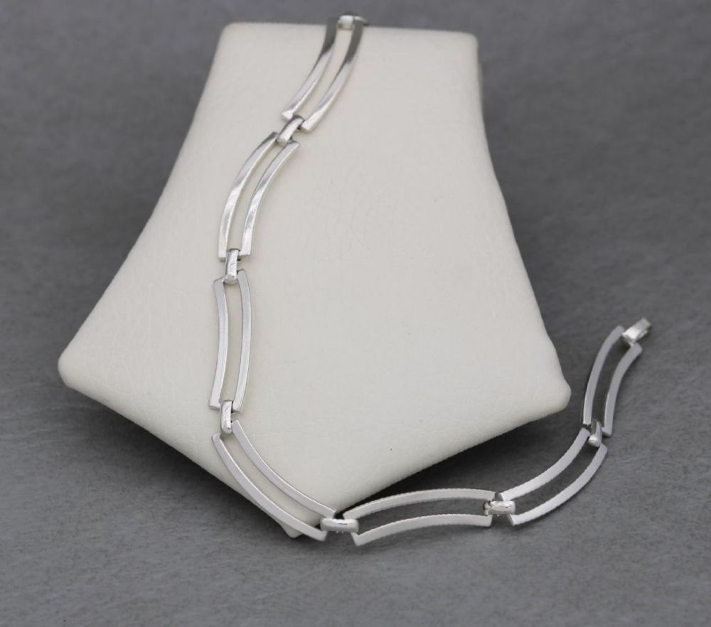 Sterling silver wavy open rectangular panel bracelet