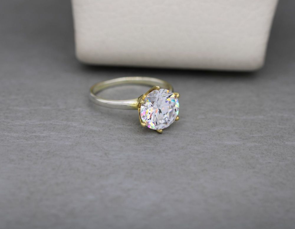 REFURBISHED Proud sterling silver & clear stone solitaire ring with a gilt accent (K ½)