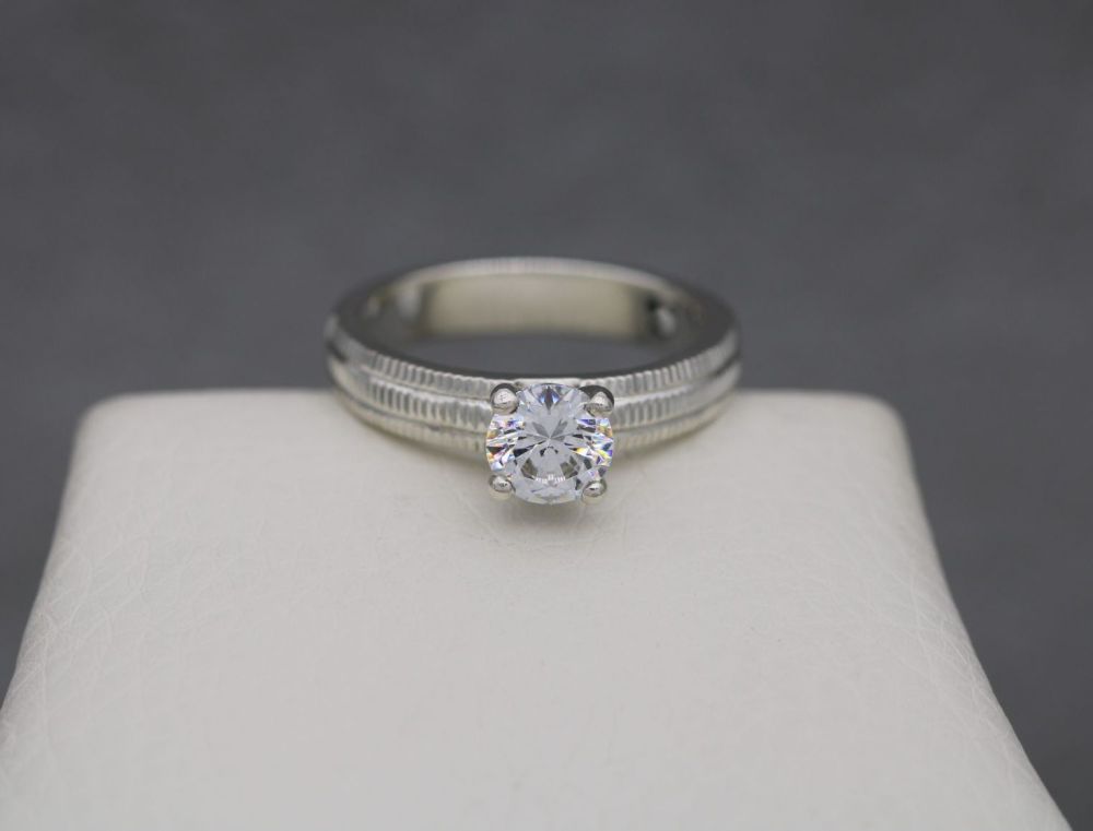 REFURBISHED Thick set sterling silver & clear stone solitaire ring with textured shoulders (N)