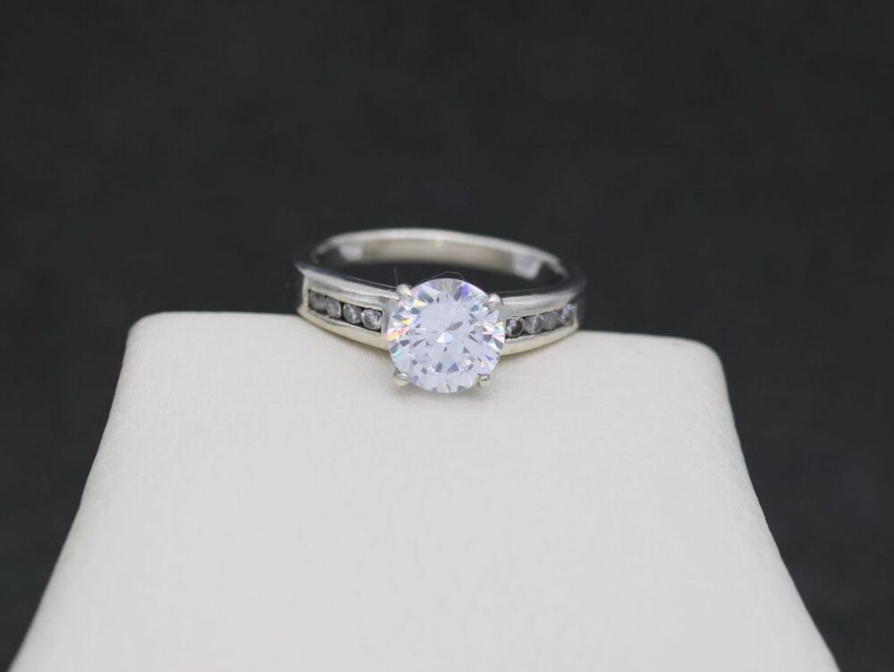 REFURBISHED Sterling silver & clear stone accented solitaire ring (O ½)