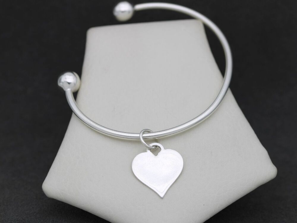 REFURBISHED Sterling silver torque bangle with heart charm