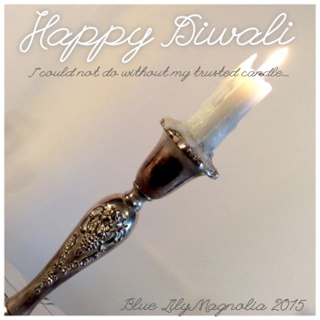 happy diwali candle burning blue lily magnolia