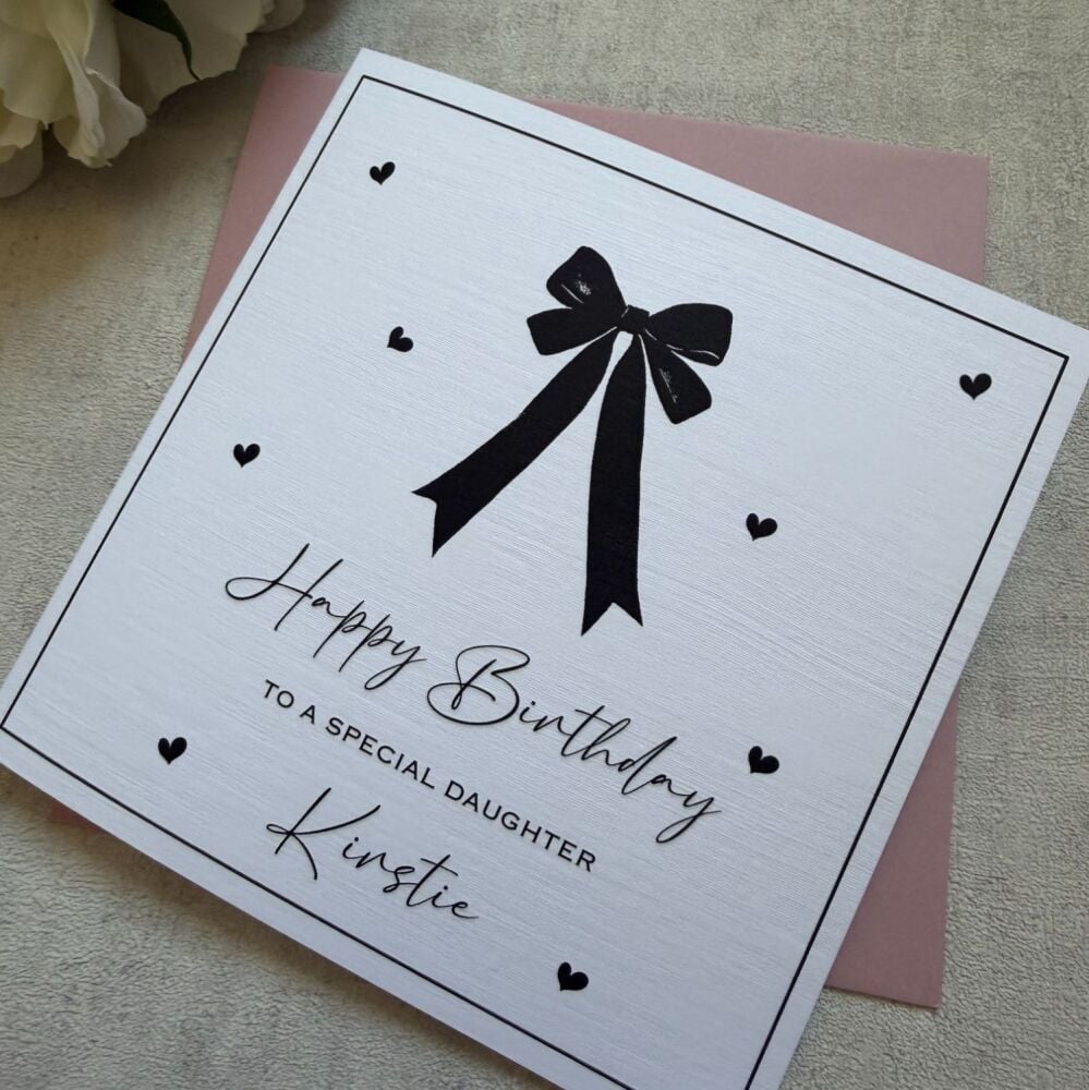 Birthday card for her with black bow and hearts