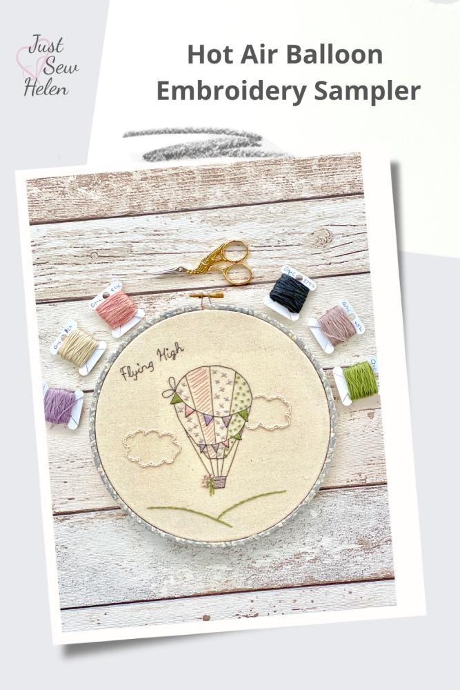 A photo of a Hot Air Balloon Embroidery Sampler shown on a poster.  Just Sew Helen logo of a pink heart is in the top left corner.