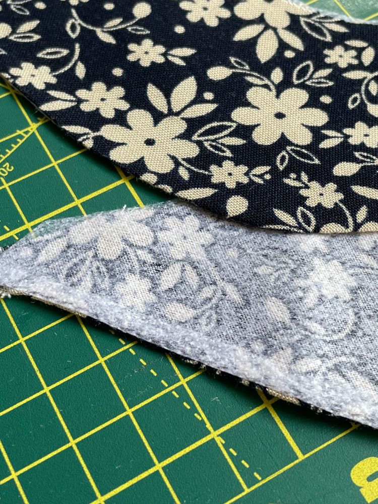 A fabric neck facing with a hemmed finished edge