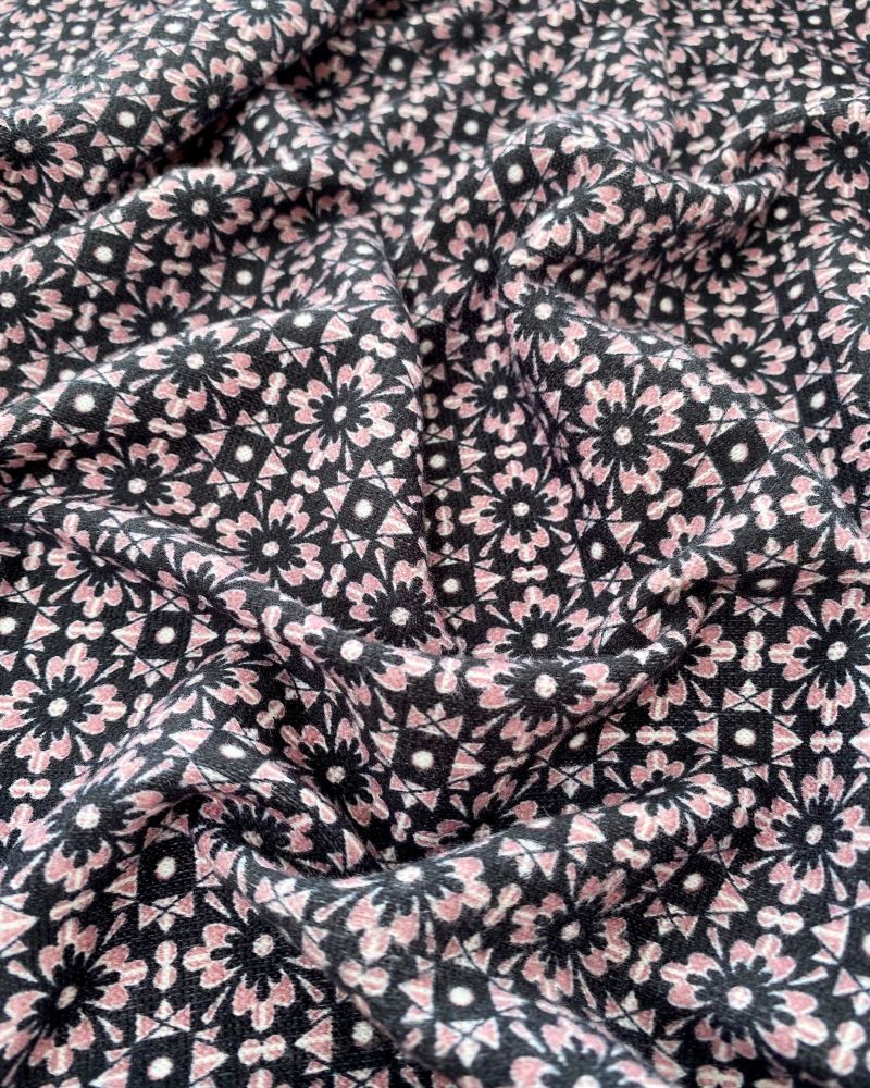 Black and pink geometric knit fabric