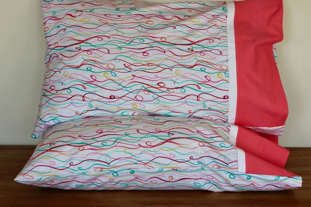 Pair of Party Streamers Pillow Cases