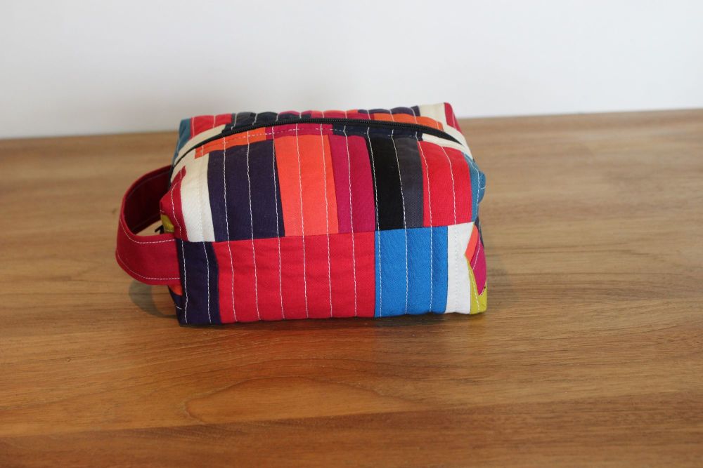 A Dorset Patchworks Bits and Bobs Quilted Box Pouch (Abstract Red and Black