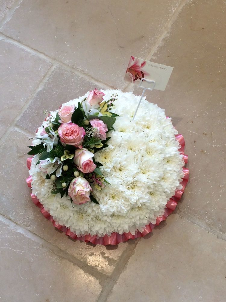formal traditional funeral tribute posy pad chrysanthemum based pink