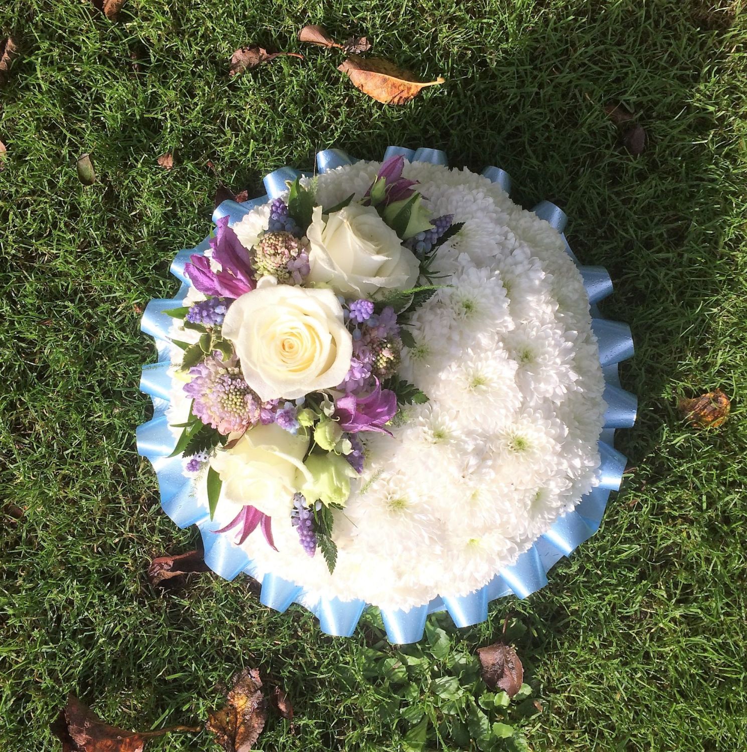 formal traditional funeral tribute posy pad chrysanthemum based pink