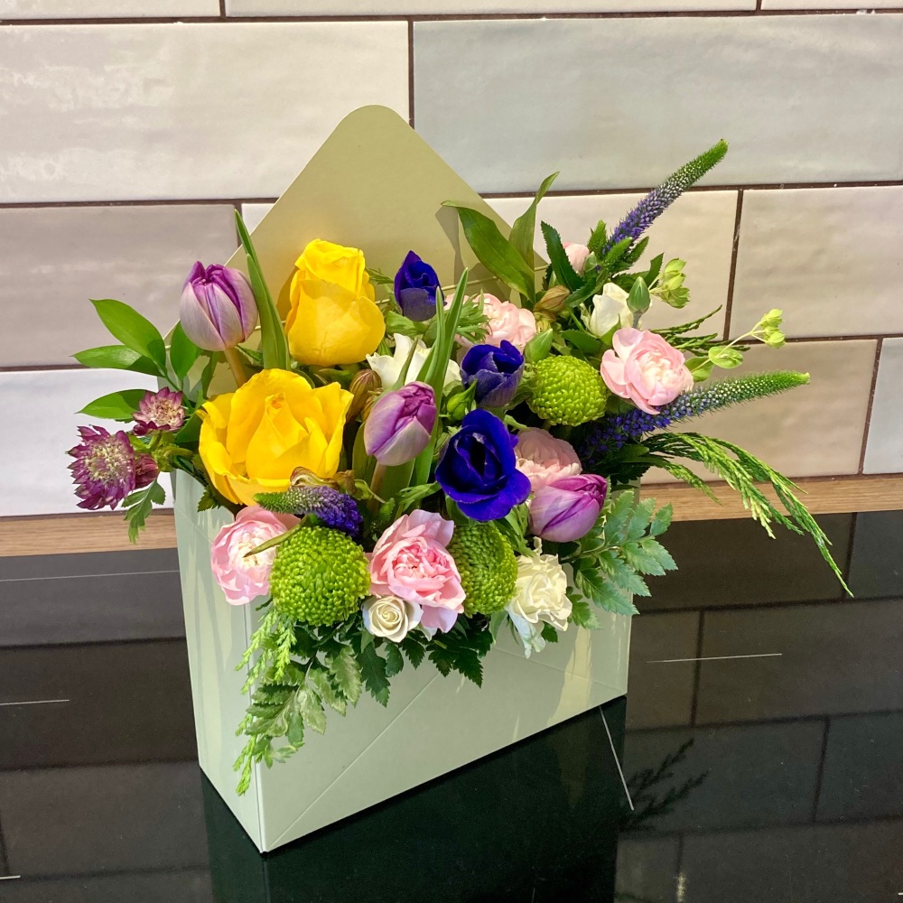 Envelope box floral arrangement - envelope shaped box filled with fresh flo