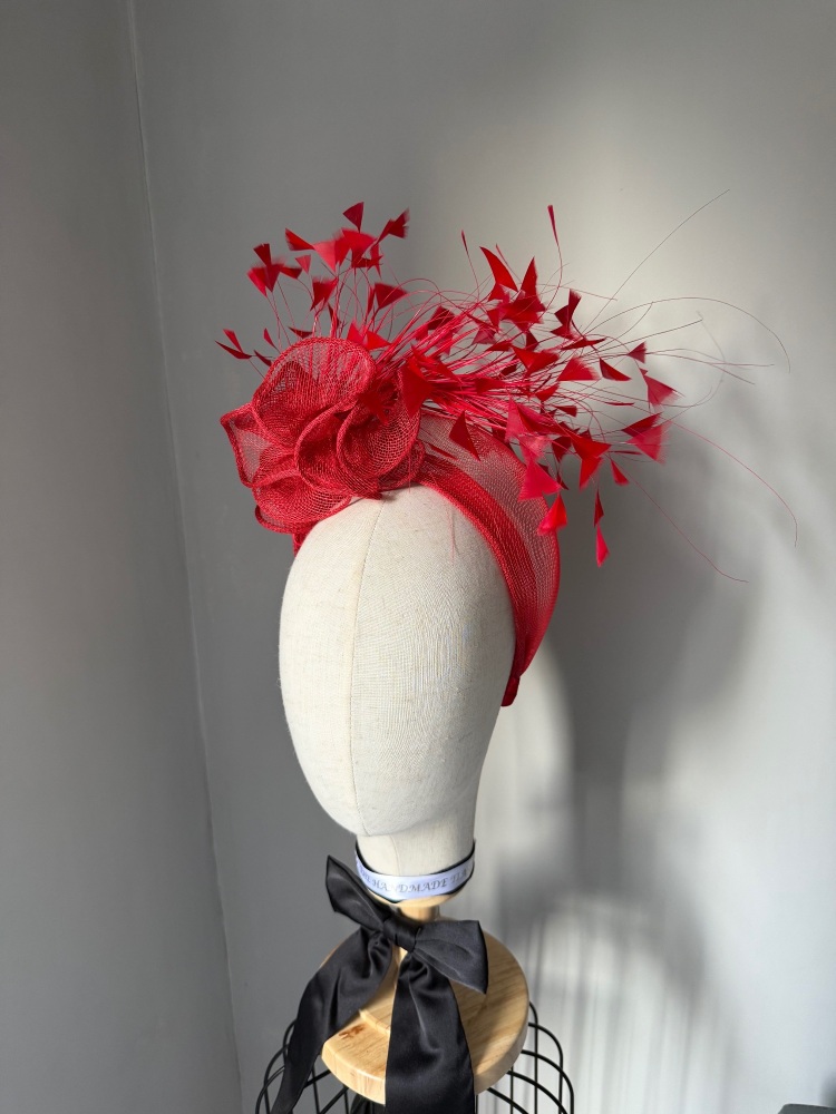 Red ruffle fascinator with feathers
