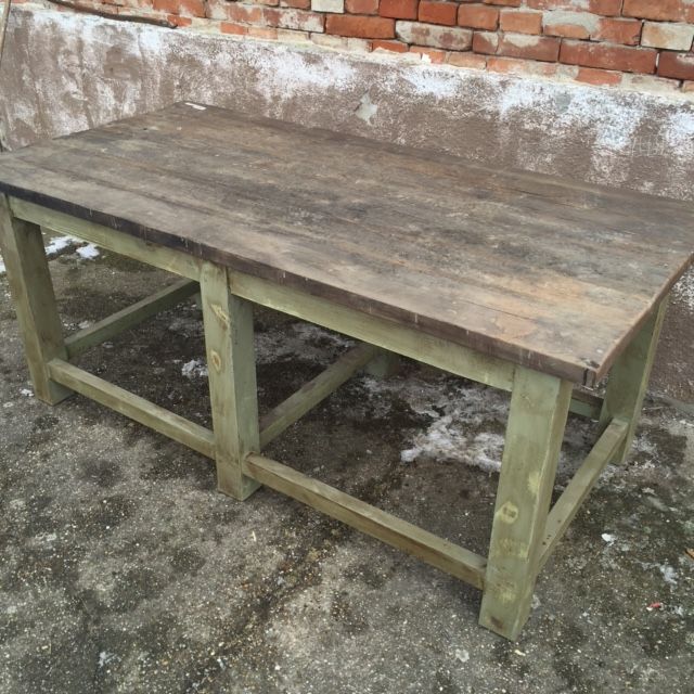 wood table with green base/legs