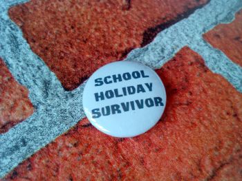 School Holiday Survivor 25mm/1 inch pin badge