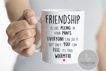 Friendship is like peeing your pants mug