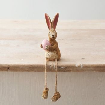 Sitting Rabbit with dangly legs and pink egg
