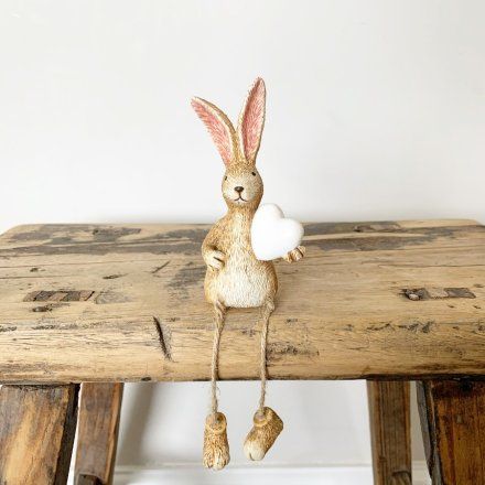 Sitting Rabbit with dangly legs and white heart